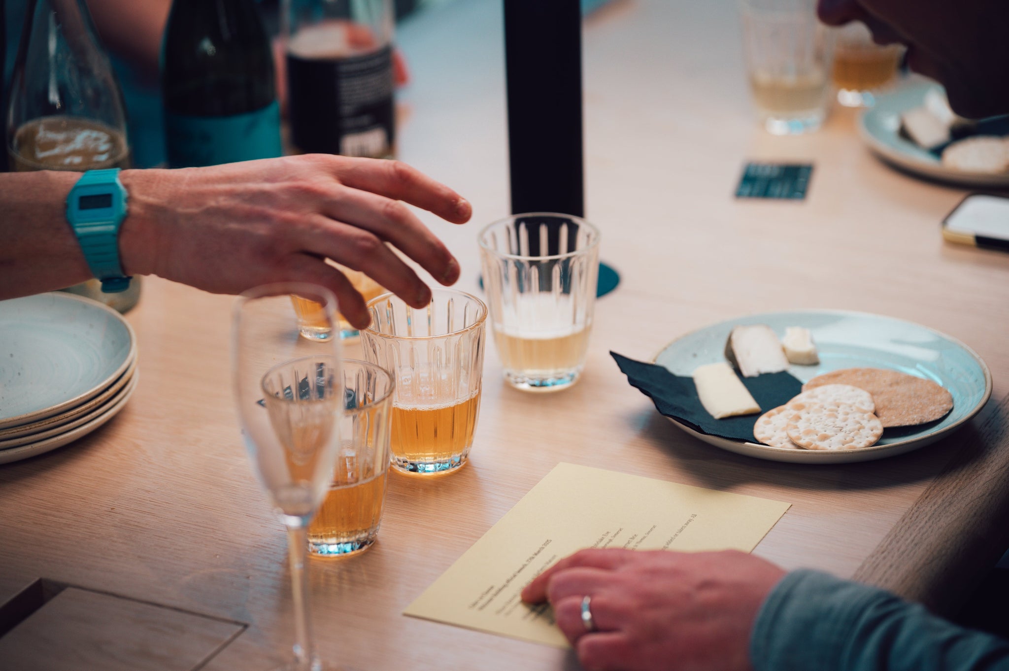 close up of cider and cheese tasting