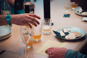 close up of cider and cheese tasting